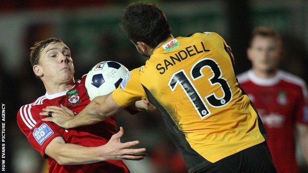 Wrexham's Danny Wright and Newport County's Andy Sandell compete for the ball