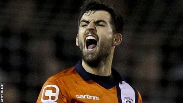 Alex Lawless of Luton celebrates after the final whistle during the FA Cup