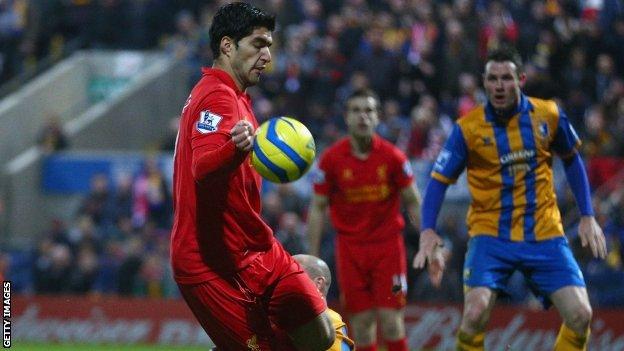 Luis Suarez scores Liverpool's second