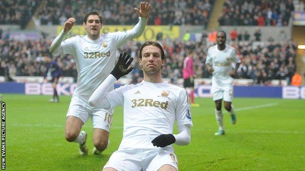 Michu celebrates after scoring against Arsenal