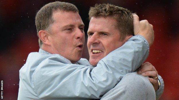 Coventry manager Mark Robins celebrates with assistant Steve Taylor
