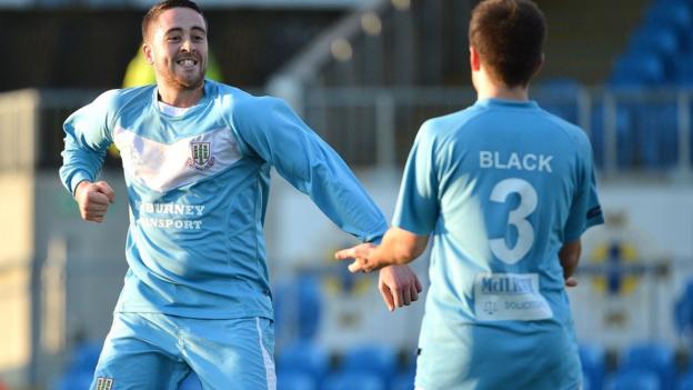 There's a big smile from Shane Dolan after the striker puts Ballymena United ahead against Warrenpoint Town at the Showgrounds