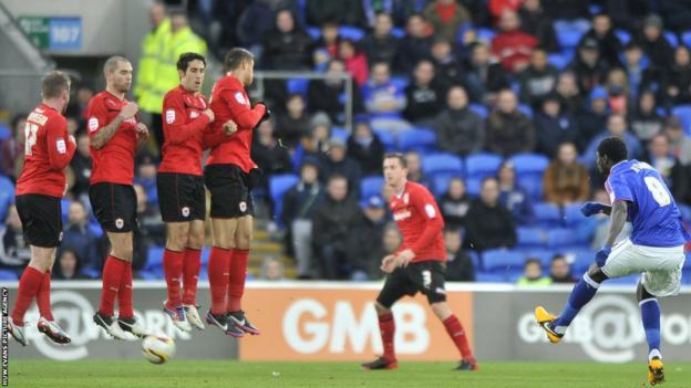 Ipswich Town midfielder Guirane N'Daw, who hit the post with a 30-yard drive, fires a free-kick under the Cardiff City wall