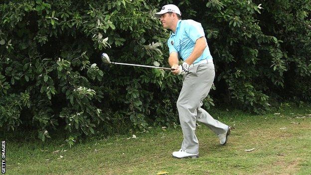 Louis Oosthuizen plays his approach on the eighth hole in the final round