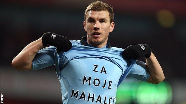 Edin Dzeko celebrates after scoring Manchester City's second goal