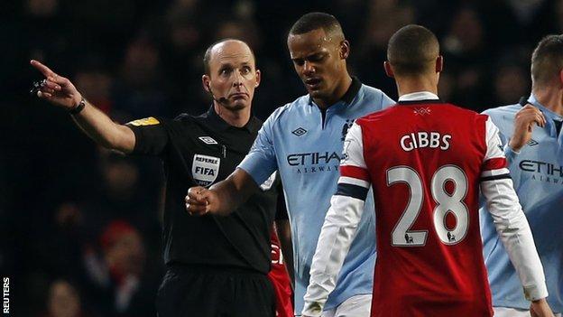 Vincent Kompany leaving the pitch after he was sent off by Mike Dean