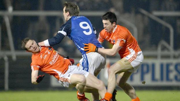 Armagh's Finnian Moriarty and Aidan Forker attempt to dispossess Gearoid McKiernan of Cavan at the Athletic Grounds