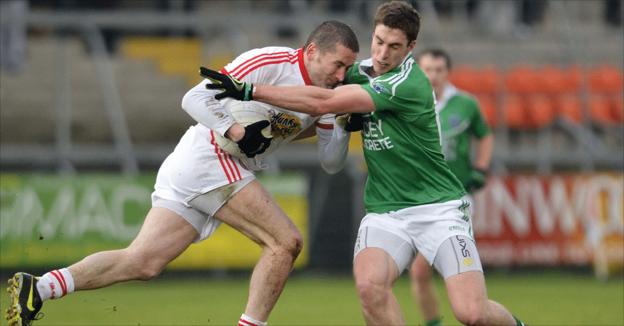 Tyrone forward Stephen O'Neill takes on Fermanagh's Eoin Donnelly during the first half