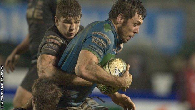 Treviso's Valerio Bernabo is tackled by Sam Lewis and Campbell Johnstone