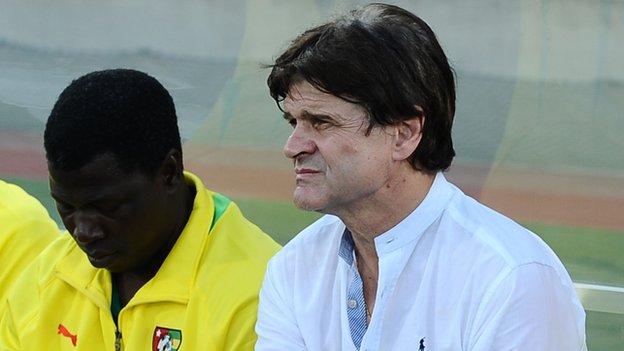 Togo coach Didier Six (right)