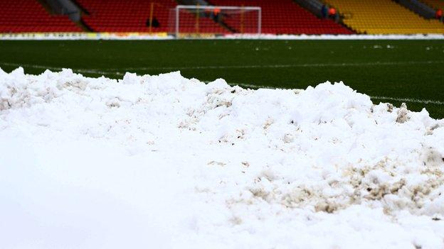 Snow on a football pitch