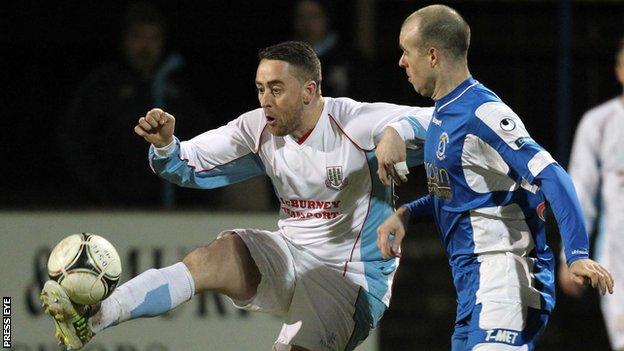 Shane Dolan of Ballymena in action against Dungannon's Adam McMinn