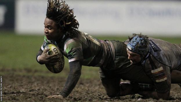 London Irish's Marland Yarde is tackled by Cardiff Blues' Michael Paterson during the Welsh side's 10-6 LV=Cup win at the Arms Park.