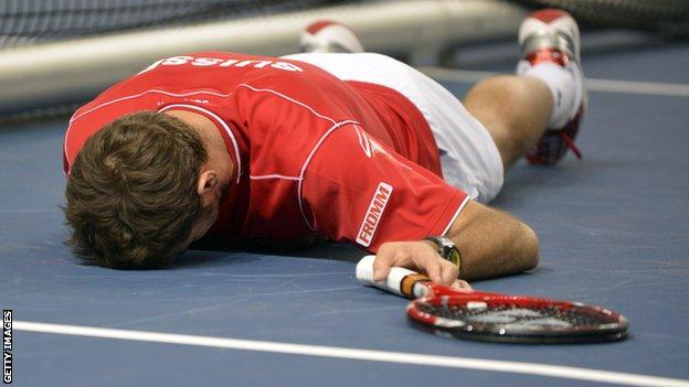 Stanislas Wawrinka has a lie-down during the epic Davis Cup match