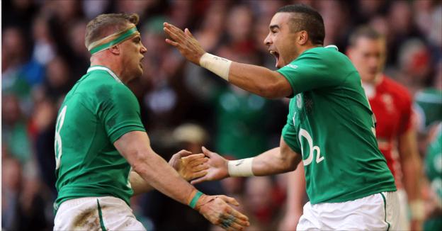 Ireland captain Jamie Heaslip celebrates with Ireland try-scorer Simon Zebo during the first half