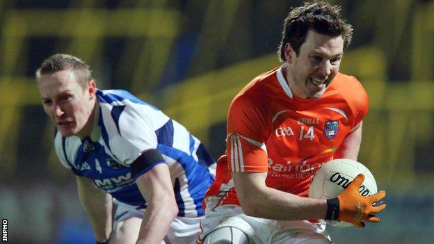 Armagh's Stefan Forker bursts away from Laois player Peter O'Leary
