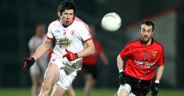 Sean Cavanagh of Tyrone in action against Down's Conor Laverty at Pairc Esler