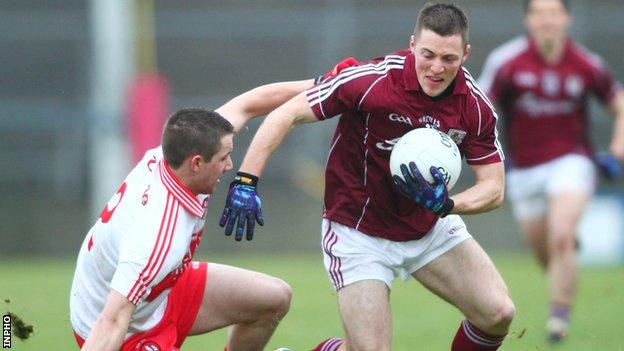 Galway's Danny Cummins fends off Derry's Ryan Ferris at Salthill
