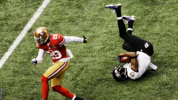 Jacoby Jones (right) scores his first touchdown during Super Bowl XLVII