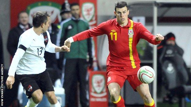 Gareth Bale takes on Austria full-back Markus Suttner