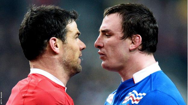 Wales scrum-half Mike Phillips exchanges pleasantries with France number eight Louis Picamoles