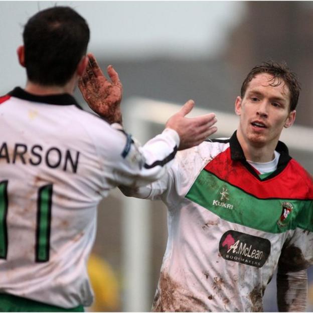 Stephen Carson congratulates David Howland who scored Glentoran's fifth goal in their Irish Cup win away to Bangor