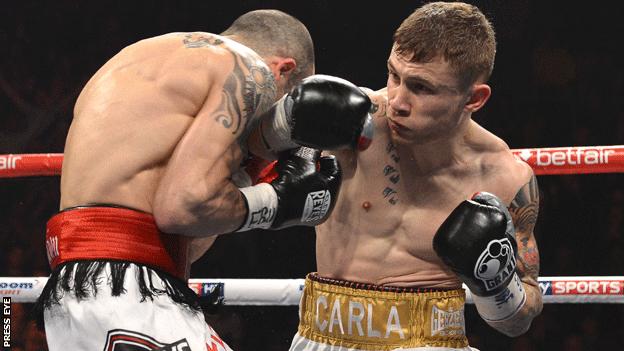 Martinez takes a punch from Frampton