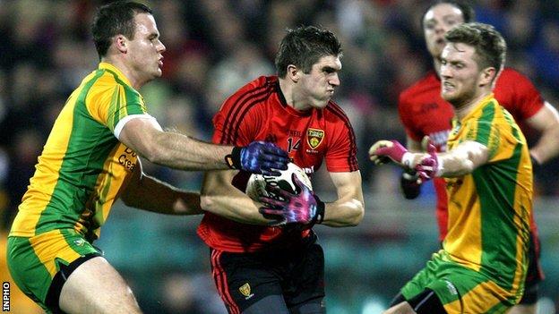 Donegal's Neil McGee tackles Connaire Harrison of Down