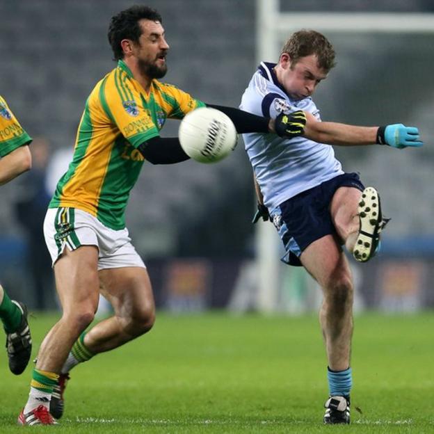 Finuge half-forward Paul Galvin attempts to block the clearance of Brian Mulligan during the All-Ireland Intermediate Club final in Dublin