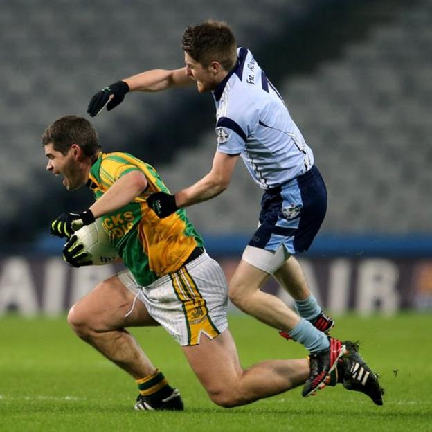 Finuge forward Eamonn Fitzmaurice is challenged by Martin Hughes of Father Rock's during the final at Croke Park