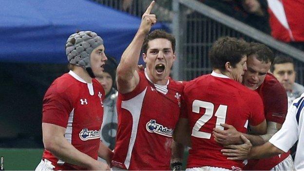 George North celebrates with his Wales team-mates as they beat France 16-6 in the Six Nations at the Stade de France