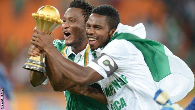 Nigerian players celebrate with the Nations Cup trophy