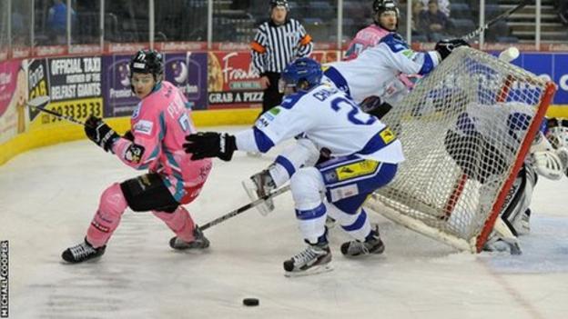 Belfast's Craig Peacock is challenged by Blaze opponent Stephen Chalmers