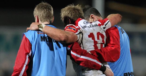 Ulster centre Luke Marshall is helped from the pitch by Ulster medical staff