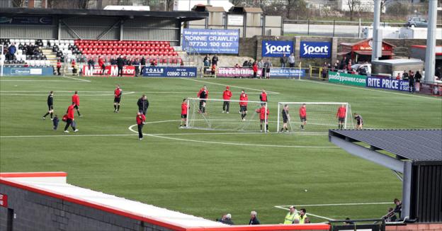 Players go through their paces at Seaview before the game was postponed because of a protest outside the ground