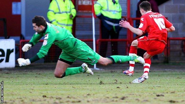 Notts County keeper Bartosz Bialkowski brings down Jamie Paterson for Walsall's first-half penalty