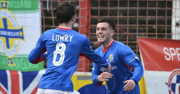 Philip Lowry is congratulated by Brian McCaul after putting Linfield in front against Glentoran
