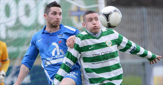 Jason McCartney and Ryan Deans battle for possession during Donegal Celtic's win over Ballinamallard