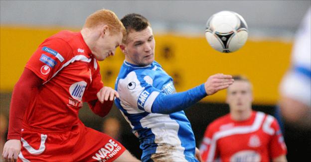 Joseph McNeill and Ryan Harpur in aerial action as Dungannon beat Portadown 2-0