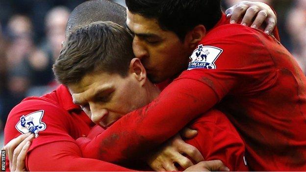 Steven Gerrard is congratulated by Liverpool team-mates