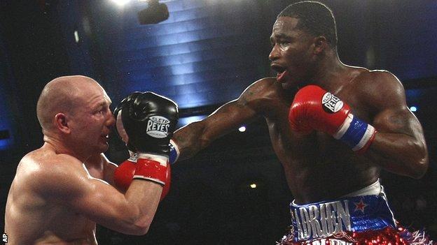 Gavin Rees takes a solid right from WBC lightweight champion Adrien Broner