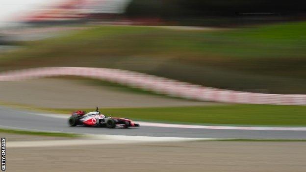 Jenson Button takes his McLaren for a spin at the Circuit de Catalunya