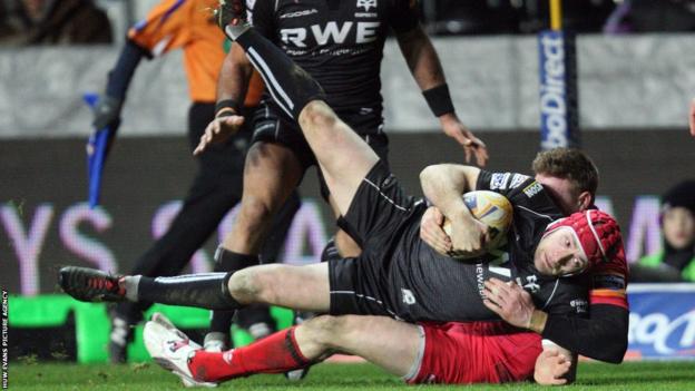 Full-back Richard Fussell is brought down but his initial break sets Ospreys up for their third and final try in a 24-7 win over Edinburgh