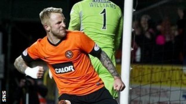 Johnny Russell celebrates his 86th minute penalty