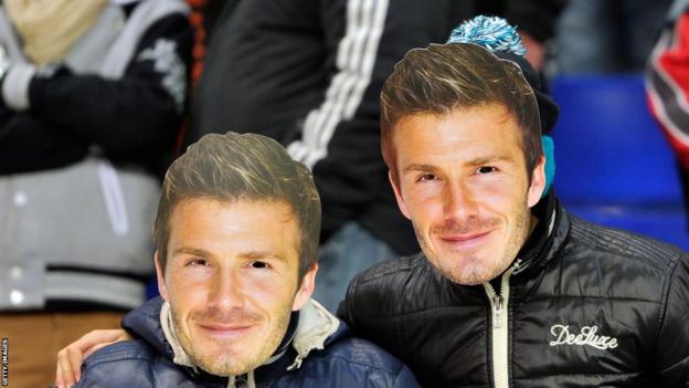 Two Paris St-Germain FC fans wear David Beckham masks during the Ligue 1 match between Sochaux and Paris Saint-Germain