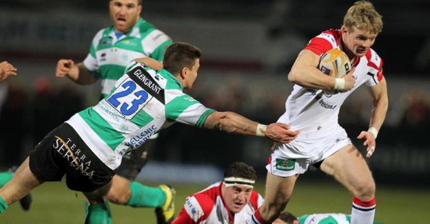 Treviso replacement Tommaso Ianonne attempts to tackle Ulster try-scorer Stuart Olding as he heads for the line