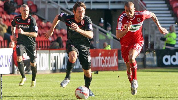Cardiff City's Tommy Smith and Middlesbrough's Kieron Dyer compete for the ball in the Championship at the Riverside