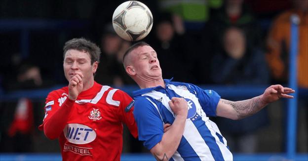 Kevin Braniff in aerial action against Aaron Canning during Portadown's 3-0 Irish Cup victory at Ballycastle Road