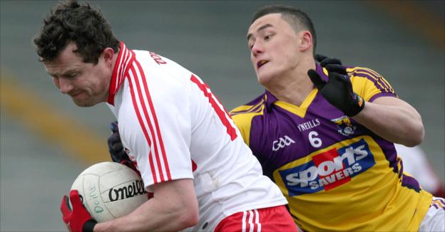 Derry's Barry McGoldrick shields the ball from Lee Chin of Wexford during the Division Two game