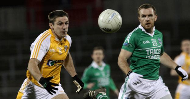 Tony Scullion and Martin McGrath keep their eyes on the ball at Casement Park